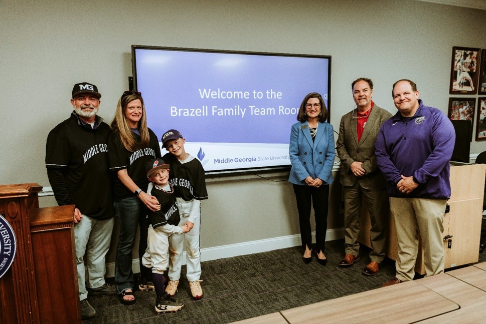 L to R: Christopher Brazell, Gillian Brazell, Bennett Brazell, Holden Barnard, Nancy White (VP of University Advancement), Casey Paulk (MGA Foundation Board Chair), and Michael Brown (MGA Athletic Director).